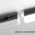 Example of a direct connection between two continuity linear light fixtures with a black finish.