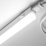 Slim linear LED luminaire with a white finish.