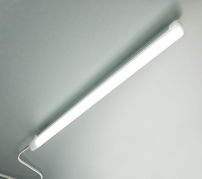 Slim linear L E D luminaire with a white finish.