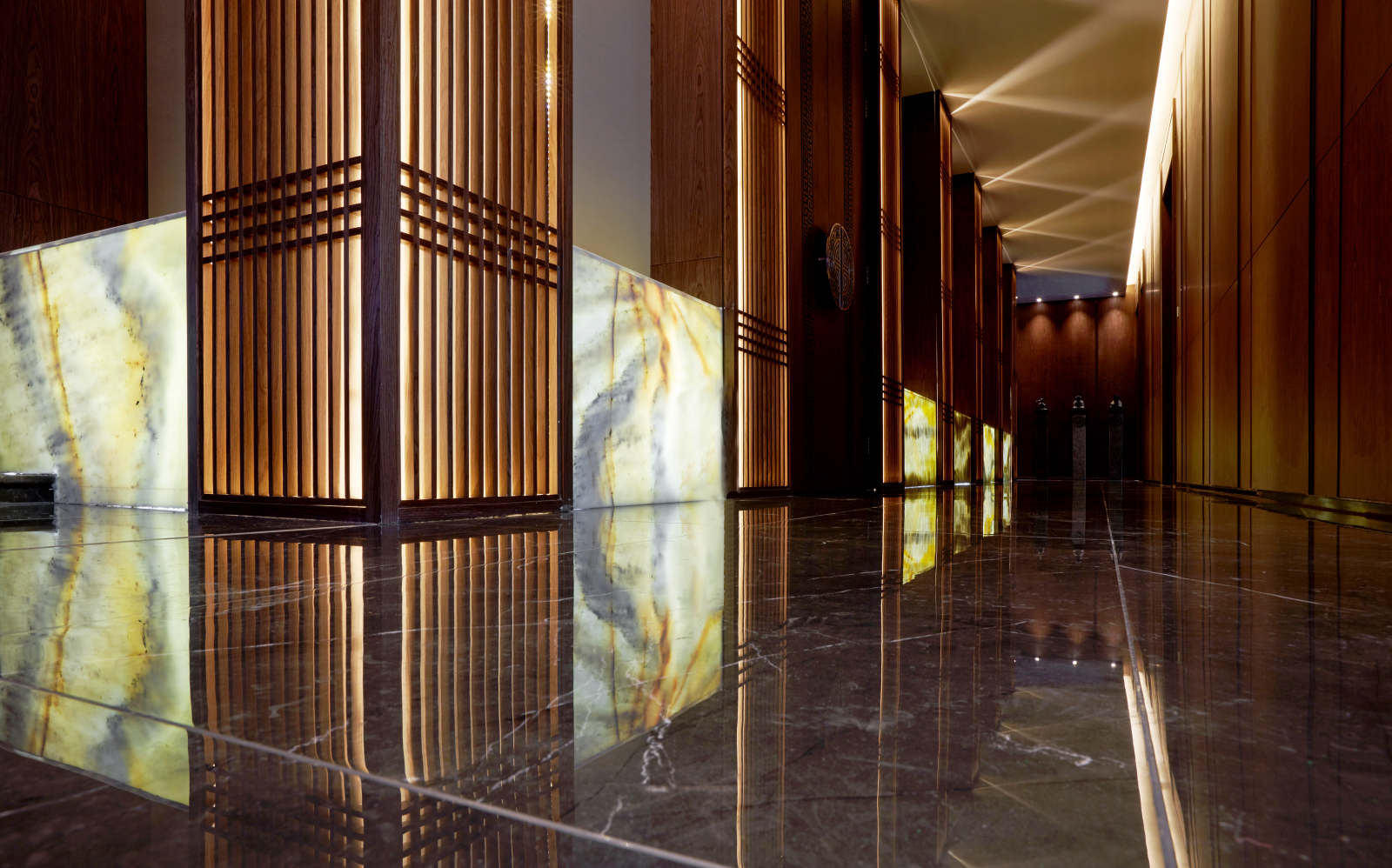 Backlit panels marble in hotel hallway